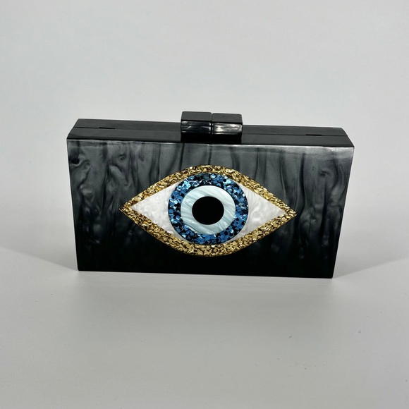 Evil Eye Acrylic purse
7.87L x 1.7W
Plenty of space for phone. NWT - Picture 2 of 6